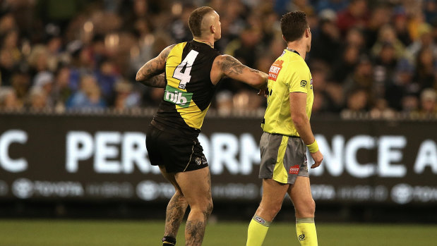 Touched up: Richmond's Dustin Martin appears to make intentional contact with umpire Jacob Mollison.