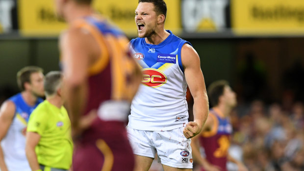 May day: Gold Coast co-captain scores a major to help soak up the pressure against Brisbane.