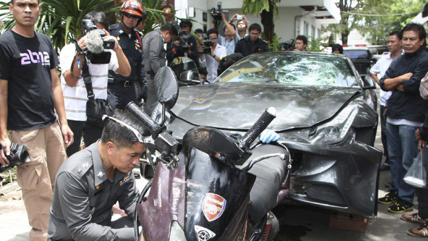 A Ferrari that was driven by Vorayuth Yoovidhya and a motorcycle, both involved in the accident, are displayed by police in Bangkok in 2012.