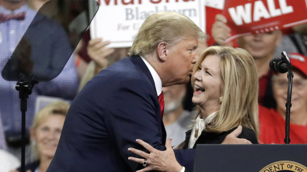Representative Marsha Blackburn is welcomed by President Donald Trump at a rally in Tennessee. 