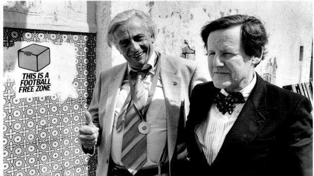 Age journalist and founder of the Anti Football League, Keith Dunstan, presents Sir Les Patterson (Barry Humphries) with the Anti Football League’s top award, the Wilkie Medal. 