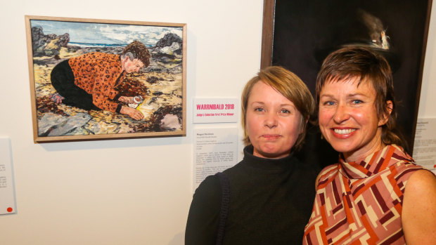 Megan Nicolson (left) with a portrait of Colleen Hughson (right) titled <i>Good Will Nurdle Hunter</i>. 
