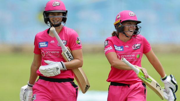 Ellyse Perry and Alyssa Healy laugh their way off the field after their incredible innings. 
