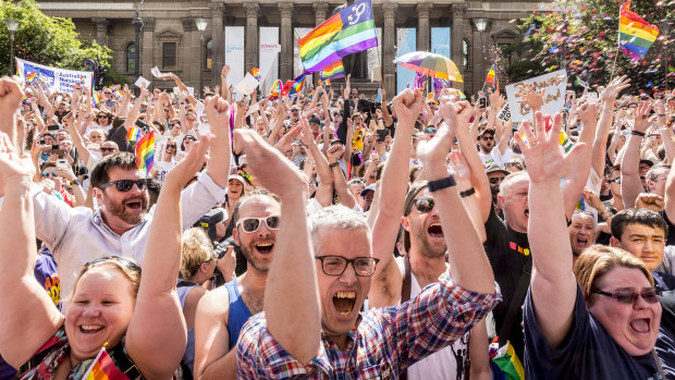 Melburnians celebrate the 'Yes' vote outside the State Library last year. 
