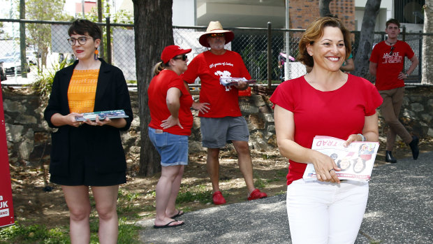 Awkward: Jackie Trad and Greens rival Amy MacMahon hand out how-to-cards at a polling booth in West End on Saturday.
