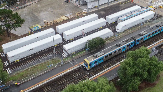 Carriages next to North Williamstown railway station, from the $5.2 billion train order made by the Andrews government. They have been shipped from China and are awaiting assemblage.
