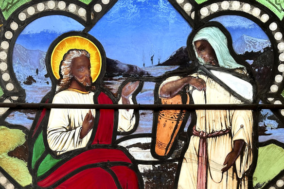 A detail of a near 150-year-old stained-glass window depicts Christ, left, speaking to a Samaritan woman, installed in the now-closed St Mark’s Episcopal church in Warren, Rhode Island.