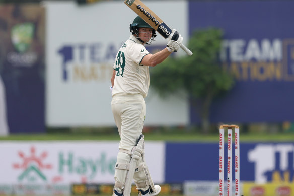 Steve Smith celebrates scoring his 10,000th Test run.