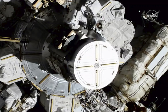 In this photo provided by NASA astronauts Christina Koch and Jessica Meir exit the International Space Station - they can be seen in the middle top of the photo.