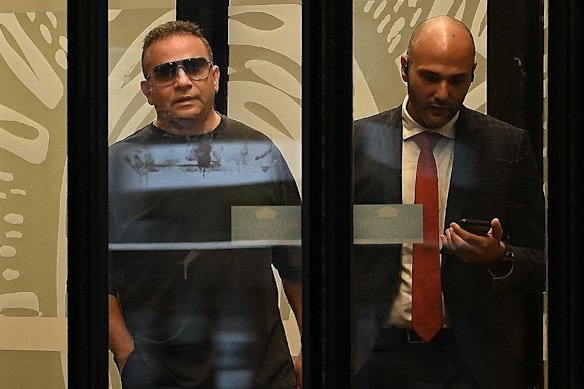 Eddie Hayson (left) departs Downing Centre Local Court with his lawyer, Abbas Soukie, following a secret bail hearing on Thursday.