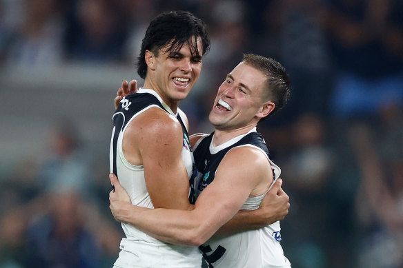 Elijah Hollands of the Blues celebrates a goal with teammate Matthew Owies.