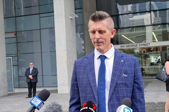 Lee Lovell, whose wife Emma was stabbed to death in a home invasion in which he was also attacked, outside court in Brisbane at an earlier hearing.