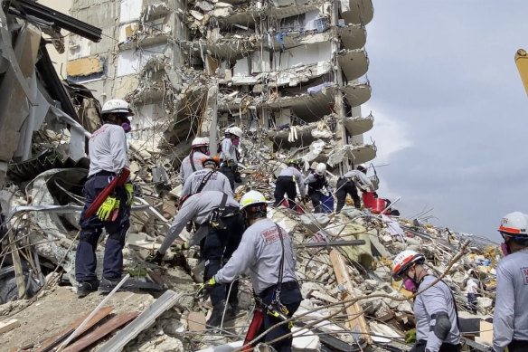 Search-and-rescue teams sift through the rubble of the collapsed apartment building in Miami on Friday, local time.
