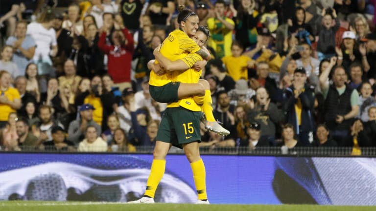 Emily Gielnik (right) celebrates with Matildas teammate Chloe Logarzo after scoring against Chile.