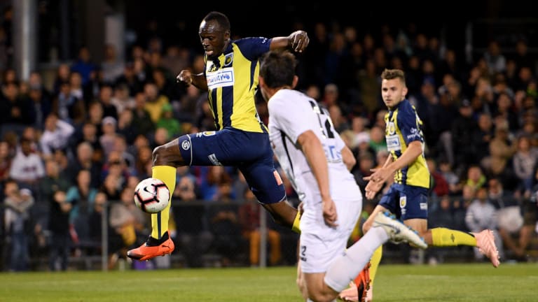 Bolt from the blue: Jamaican sprinter turned footballer was in full flight for the Mariners, scoring twice against Macarthur South West United.