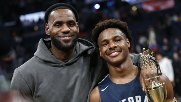 LeBron James, left, poses with his son Bronny .