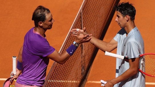 Rafael Nadal (left) shakes hands after a win over Australian Alexei Popyrin in Madrid recently.