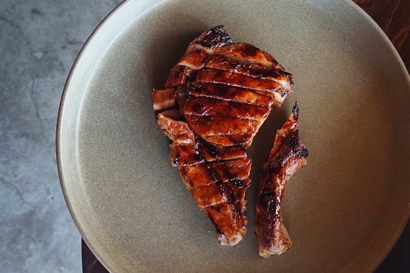 Grilled pork chop with burnt onion glaze.