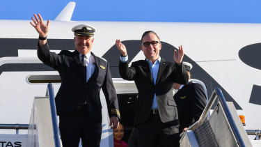 Qantas CEO Alan Joyce (right) and Captain Sean Golding (left) stepping off the airline's non-stop flight from New York to Sydney on Sunday. 