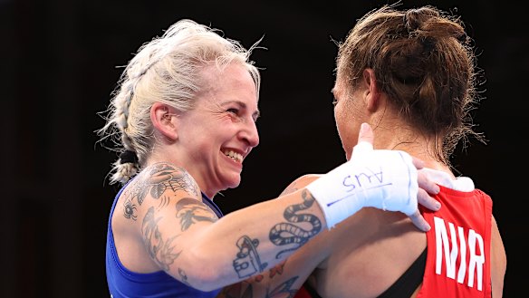 Harris, left, smiles after a bout at the Commonwealth Games in Birmingham in 2022.
