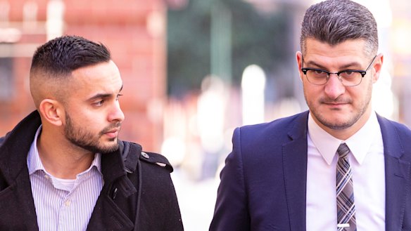 Eathan Cruse, left, outside the Supreme Court in July. 