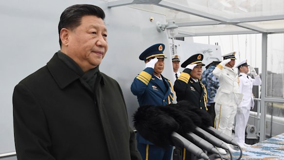 Chinese President Xi Jinping reviews a naval parade with Chinese and foreign military ships last month.