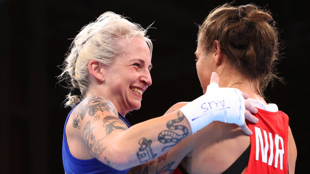 Harris, left, smiles after a bout at the Commonwealth Games in Birmingham in 2022.