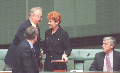 Independent MP Pauline Hanson is congratulated after her maiden speech by fellow Independents 
Graeme Campbell (left) Allan Roacher (front) and Peter Andren (right).