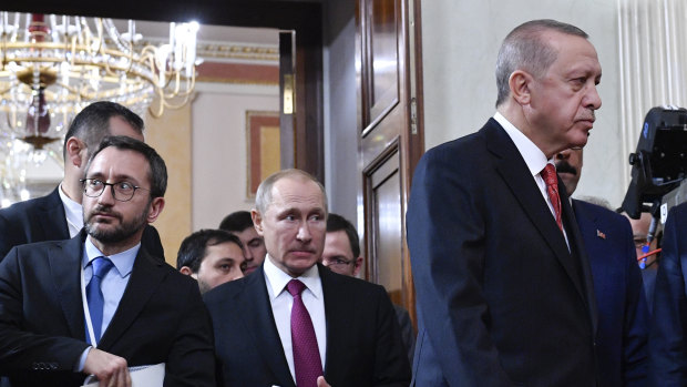 Erdogan, right, and Putin, middle, are jockeying for clout in Syria.
