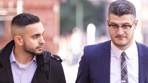 Eathan Cruse, left, outside the Supreme Court in July. 