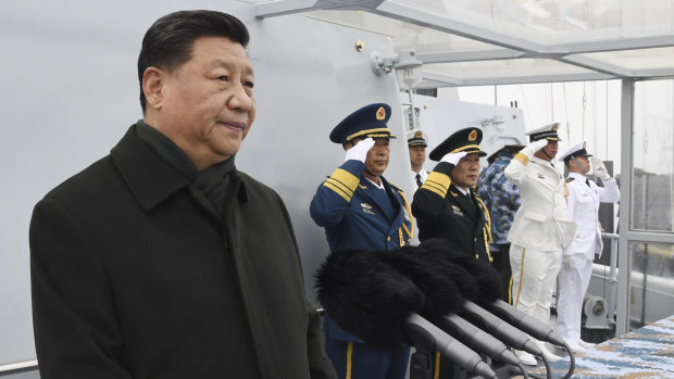 Chinese President Xi Jinping reviews a naval parade with Chinese and foreign military ships last month.