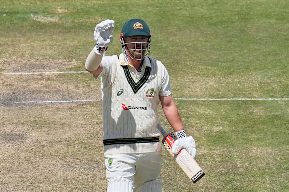 Travis Head celebrates his century.