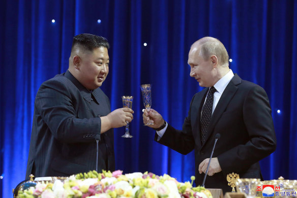 North Korean leader Kim Jong-un raises a glass with Russian President Vladimir Putin.
