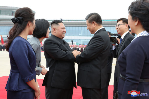 Consolidated friendship: North Korea's Kim Jong-un, left, welcomes China's Xi Jinping to Pyongyang last year.