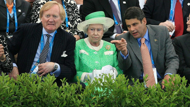 The Queen poolside with Ron Walker and then-premier Steve Bracks during the Commonwealth Games in 2006.