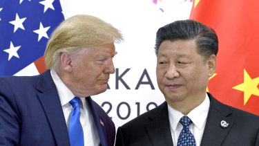 US President Donald Trump, left, with Chinese President Xi Jinping: Authorities in Beijing are getting ready to deal with a "final act of madness" from Trump in the next few weeks.