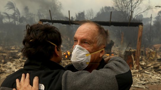 Stuart McCallister, 64, hugs his son-in-law Donald Bryce after viewing McCallister’s home, which was destroyed in the Palisades fire.