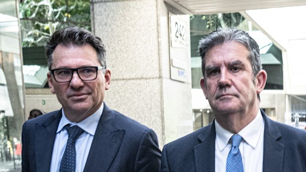 ICAC witness Martin Berry (right) leaves the commission on Tuesday.