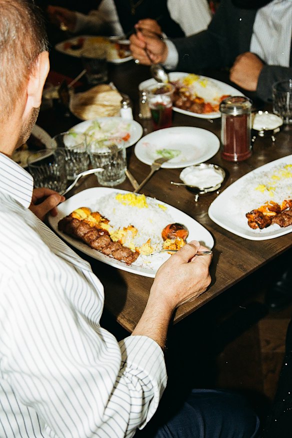 Diners eating the Persian kebabs. 