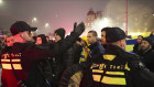 Police escort Maccabi Tel Aviv supporters to the metro station before the Ajax game.