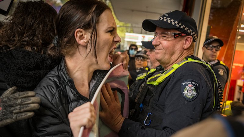 Violent clashes in Melbourne after protesters descend on women’s rights rally