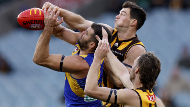 Jack Darling and Jaeger O’Meara  contest a mark.