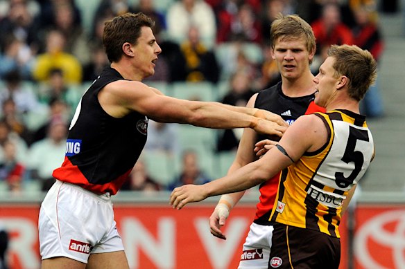 Sam Mitchell flies the flag after Matthew Lloyd’s hit on Brad Sewell.