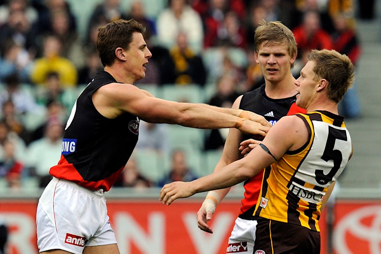 Sam Mitchell flies the flag after Matthew Lloyd’s hit on Brad Sewell.