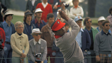 Lee Elder hits a drive during the practice round at the Masters in 1975.