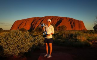 Barty poses with the Daphne Akhurst Memorial Cup at Uluru 