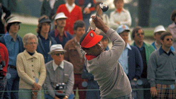 Lee Elder hits a drive during the practice round at the Masters in 1975.