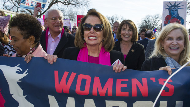 Pelosi participates in the Women's March walk to the White House in January 2018.