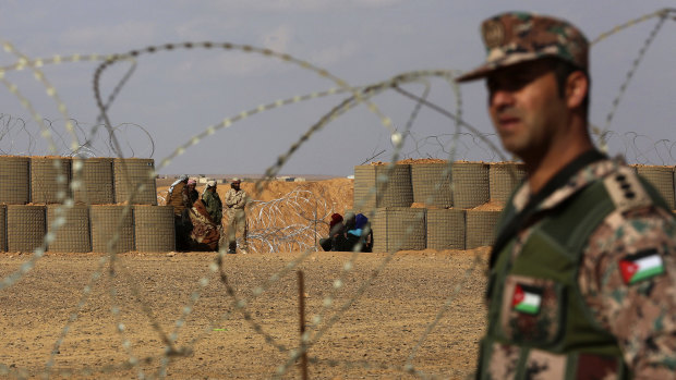 A Jordanian soldier stands at the north eastern border with Syria, close to the informal Rukban camp. 