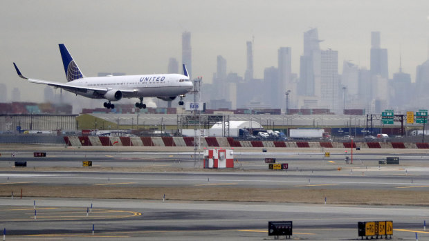 A United Airlines jet prepares to land at Newark Liberty International Airport a day after a temporary grounding of aircraft was placed after reports of drones in the flight path.